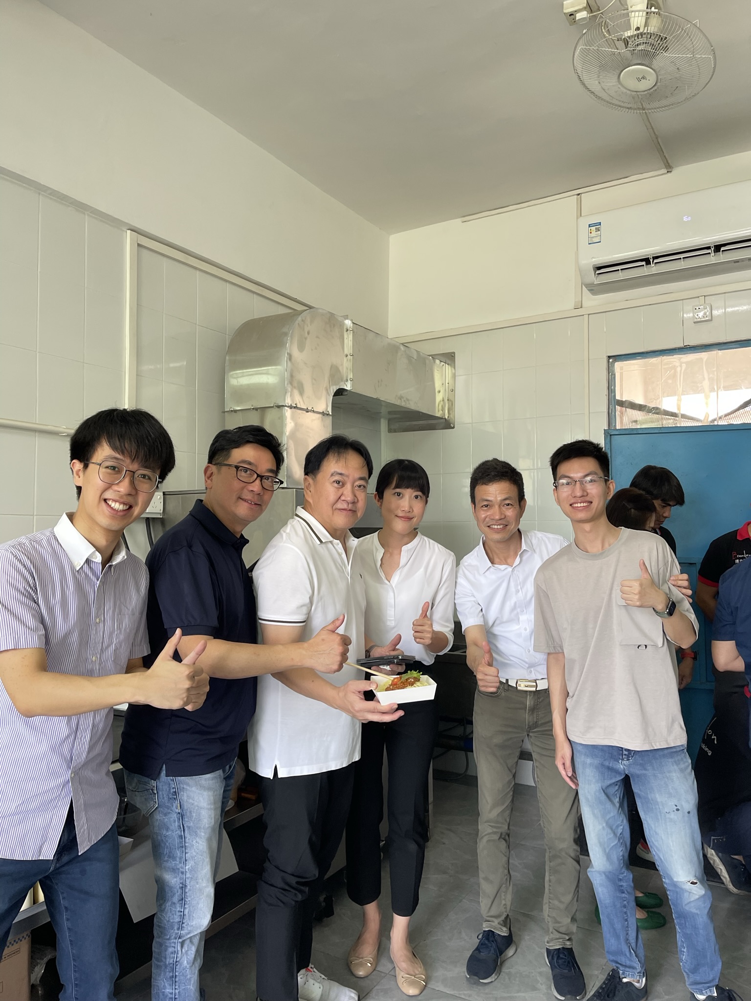 a group of people posing for a photo